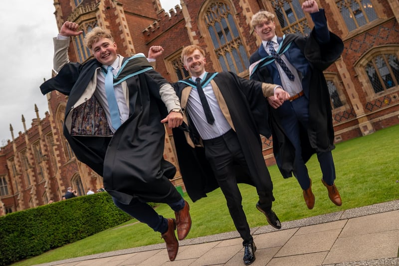 Daniel Armstrong, Rigan Convery and Peter Donaldson celebrate graduating in Law and Politics at Queen's University.
