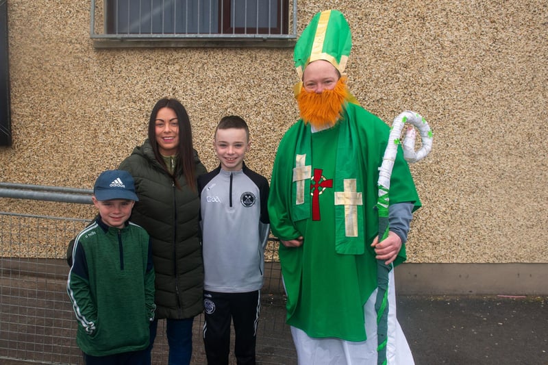 Kerrie McGibbon pictured with her sons, Ethan (7) and Jake (10) and the man himself at the St Peter's GAC St Patrick's Day parade and fun day. LM11-201.