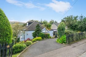 The property occupies a large mature site, with elevated views towards Belfast Harbour and Cavehill.