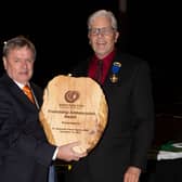 Dr Alderman Fraser Agnew MBE receiving the first-ever Friendship Ambassador Award from Greg Tilque president of Gilbert Sister Cities.