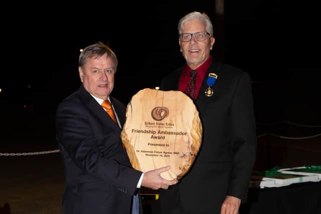 Dr Alderman Fraser Agnew MBE receiving the first-ever Friendship Ambassador Award from Greg Tilque president of Gilbert Sister Cities.