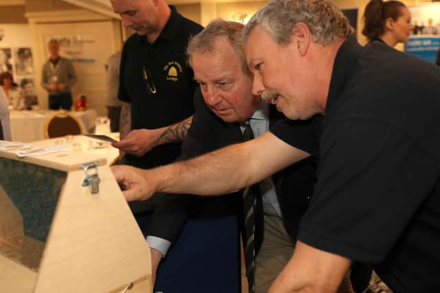 Danny Kinahan, NI Veterans Commissioner, learning more about beekeeping at a Coleraine roadshow.