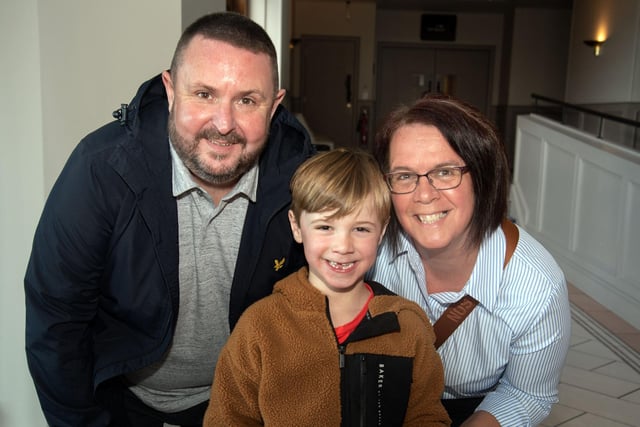 All smiles at Easter Sunday lunch at the Seagoe Hotel are Thomas and Sharon Orr and Danny McNally (5). PT14-211.