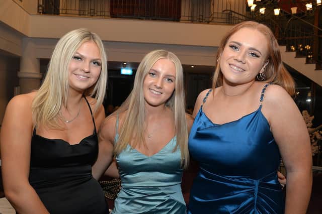 Smiles all round at the Lurgan Ladies Hockey club 100th gala dinner from left are Emma Latimer, Grace McNeill and Chloe Gordon. LM43-215.