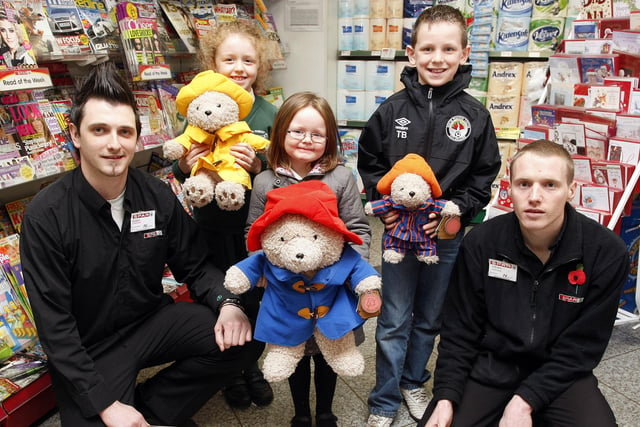 Halloween colouring competition winners Lucy O'Kane, Eimear McCrudden and Tiarnan Boorman are presented with their prizes from Robin Smith and Steven Morton of the Castlerock Road Spar in Coleraine in 2010