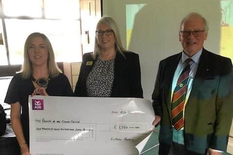 Pictured at Lisburn Probus Club, where a cheque was presented in memory of former President Ken Forbes, are his daughter Heather Flanagan, Ana Wilkinson from Friends of the Cancer Centre, and Harry McKibben, President of Club. Pic credit: Lisburn Probus Club