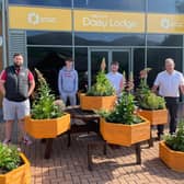 Handing over wooden planters to Daisy Lodge. Picture: Portadown Wellness Centre