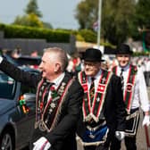 A cheery wave to a familiar face in the crowd during the 2024 Last Saturday parade in Ballymena. Picture: Graham Baalham-Curry