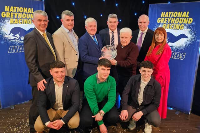 Hall of Fame 2024 inductee, Newry man Brendan Matthew, surrounded by his family being presented with his award by Pat Flanagan, Chairman of Greyhound Racing Ireland, at the National Greyhound Racing Awards hosted in Shelbourne Park on Sunday night.