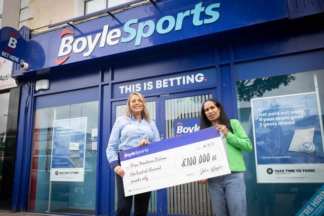 Natasha Devlin, BoyleSports shop manager at James Street in Cookstown, with £100,000 bingo winner Rosa Mendonca Fatima. Picture: John O'Neill