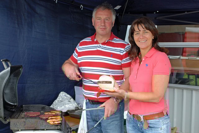 Gary and Kathy Doey look after the BBQ at the Ballycarry Primary School summer fair in 2012. INLT 25-017-PSB