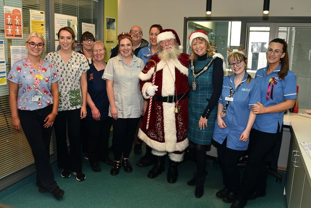 Lord Mayor of ABC Council, Alderman Margaret Tinsley pictured with Santa and staff of the Blossom Unit at Craigavon Area Hospital on Christmas Eve during her visit.