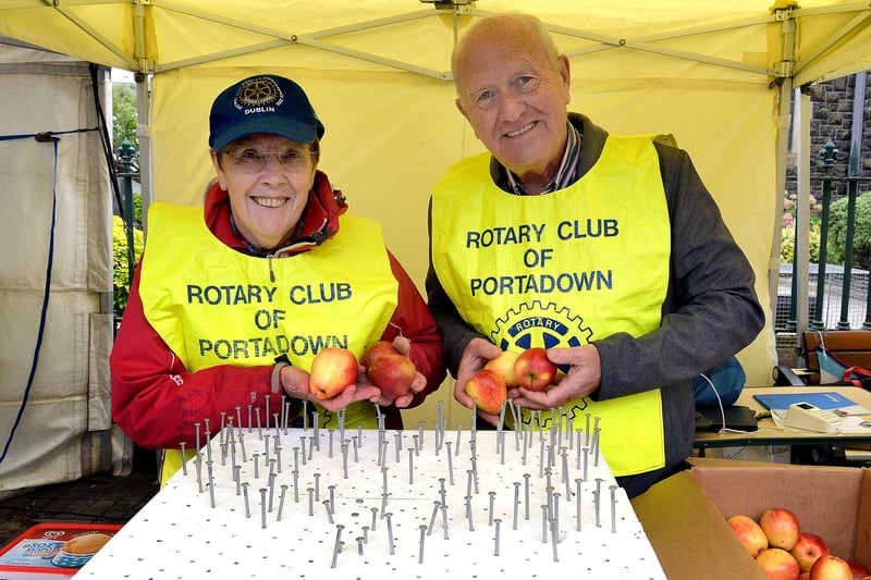 Catherine Dixon and Kevin Powell of Portadown Rotary Club raising funds for charity with their 'bed of nails' game at Country Comes To Town. PT38-221.