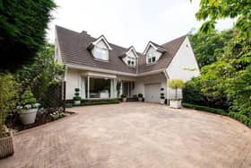 The detached chalet-style villa is set on a quiet shared private lane in a highly regarded area.