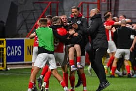 Players of Larne celebrate winning on penalties during this evening’s game at Inver Park, Larne. PIC: Andrew McCarroll/ Pacemaker Press