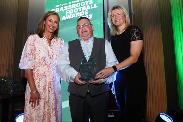 Jim McCracken receives his award from presenter Claire McCollum (left), and Northern Ireland international Julie Nelson. Photo by: Press Eye