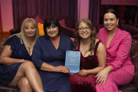 Compere Rebecca McKinney pictured with the team from Bushmills Inn Hotel – Helen Clyde, Christina McLaughlin and Jessica Wilson – Runner-up in the 'Hotels with Under 75 Rooms' category. CREDIT NIHF