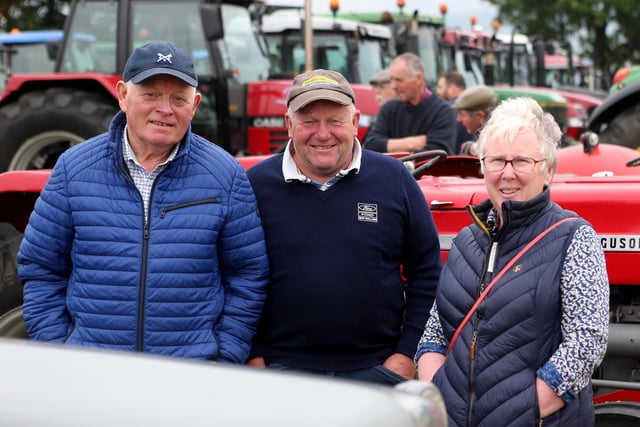 Robert and Ann McCormick with David Hoey pictured at the John Cusick Memorial tractor run in Armoy on Saturday with all proceeds going the the Castle Tower School. Credit MCAULEY MULTIMEDIA