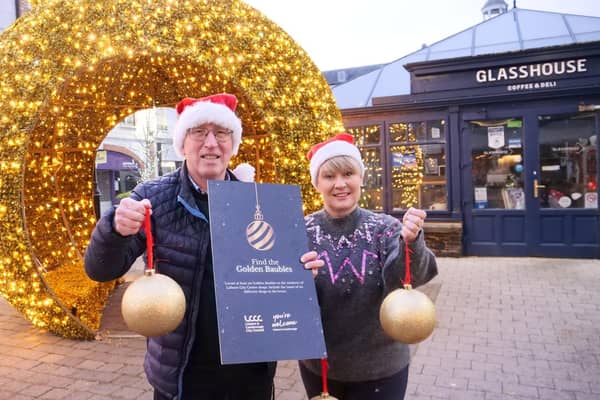 Cllr John Laverty BEM, Regeneration & Growth Chairman and Dr Katrina Collins, Owner of The Daily Apron and President of Lisburn's Chamber of Commerce launch the Golden Bauble competition in Lisburn Square. Pic credit: LCCC