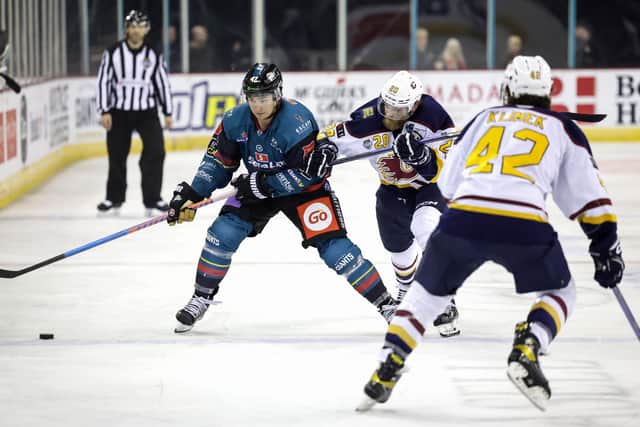 Belfast Giants’ Gabe Bast with Guildford Flames’ Sam Marklund during an Elite Ice Hockey League game at the SSE Arena, Belfast. Picture by William Cherry/Presseye