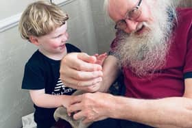 William Shiels with one of his grandchildren. Credit: Submitted