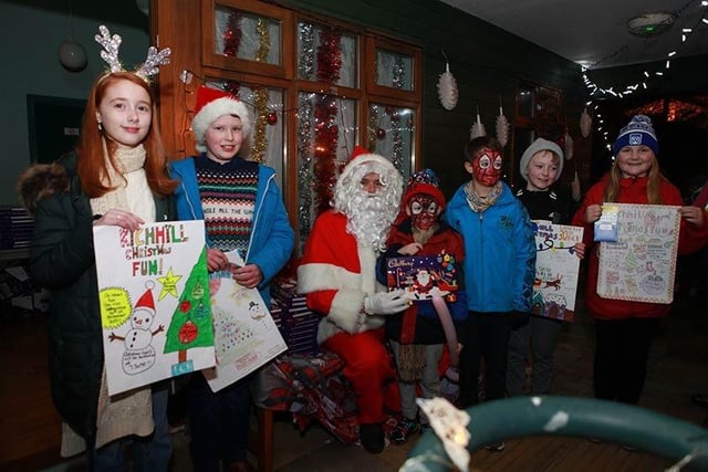 Santa with some young artists at the Richhill Christmas switch-on.