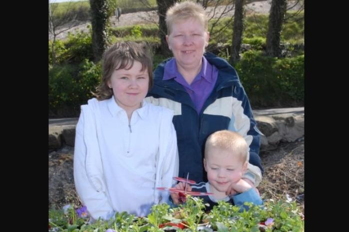 Emma, Scott and Philomena Robinson sold plants grown by Glenarm Youth Club during the fun day at the harbour on Easter Monday 2007.