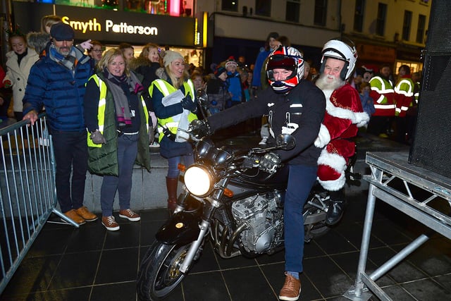 Santa ditched his sleigh in favour of a motorbike when he arrived in Lisburn for the switching on of the city's Christmas lights