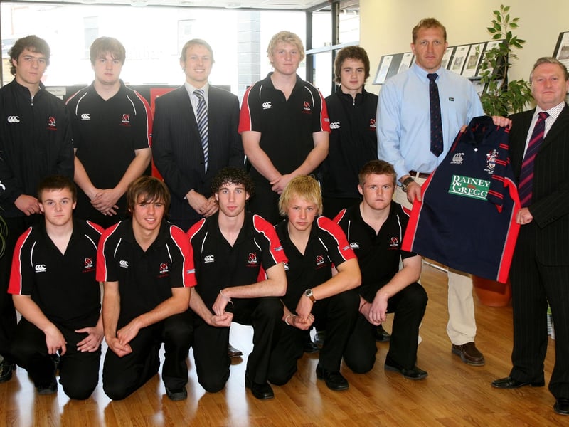 Vincent Rainey, of Rainey and Gregg, presents sponsored rugby shirts to John Andrews for the Ballymena Academy rugby team in 2007. Included is  Gavin Murray and squad members. BT43-230AC