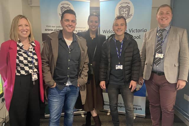 Cool FM's Pete Snodden, Rebecca McKinney and Paulo Ross with Mrs Kernaghan (vice-principal) and Mr Fulton (principal) at Victoria Primary School. Photo: Victoria PS