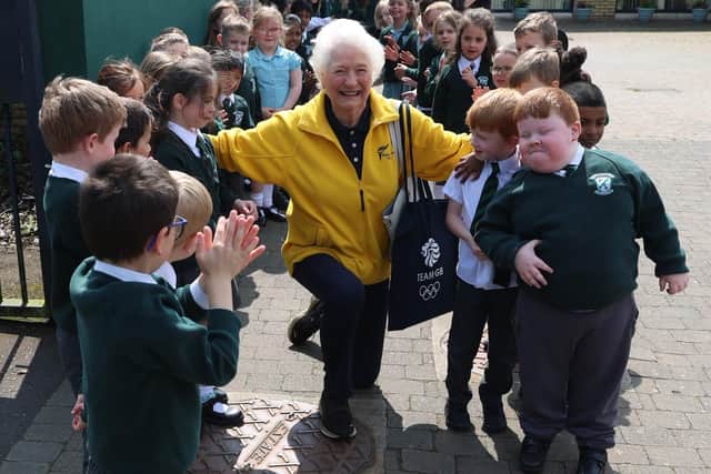 Lady Mary Peters with pupils from Finaghy Primary School