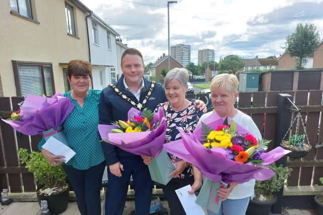 Mandy Hawthorne, Paula Willis and Ann Weldon were joined by the Mayor of Antrim and Newtownabbey, Cllr Mark Cooper, to kick-start their 60th birthday celebrations. Pic: Contributed.
