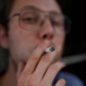 A person smoking a cigarette outside a pub in Soho, London. UK Prime Minister Keir Starmer wants to stop children from legally smoking tobacco when they become adults - with legislation expected in parliament next week. Photo: Yui Mok/PA Wire