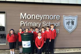 Pictured are pupils from Moneymore Primary School with their new Waterbutt.