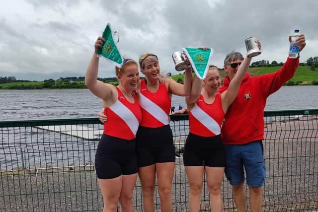 Pictured are Irish Champions Flynn Greene, Katie Shirlow and Alex Hutchinson along with Bann Rowing Club head coach Geoff Bones. Credit: Bann Rowing Club
