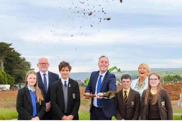 Education Minister Paul Givan cut the sod at the site of the new Ballycastle Shared Education Campus in June 2024. Included are Mr. Ian Williamson, principal, Ballycastle High School, Mrs. Geradline Duffy, principal, Cross & Passion College and pupils from both schools.Photo Credit Lorcan Doherty