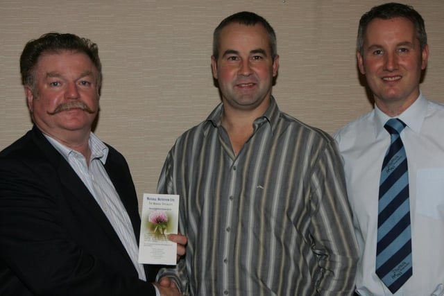 Philip Gourney, Stock Ram winner, with Peter Mackle Natural Nutrition and Geoffrey Douglas, club chairman at the North Antrim East Londonderry Suffolk sheep dinner held at McLaughlin's Corner in 2009