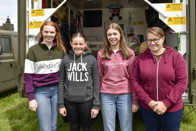 The Dilly girls, Clare, Mary Jane, Grace and their mother Judith inspect an old military ambulance at the Vintage Rally.