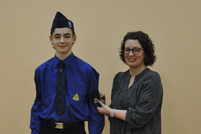 Christopher Finney receiving his President's Badge from mum Alison.