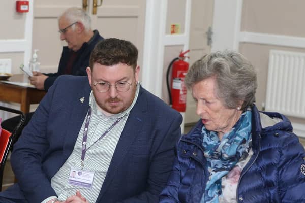 Cllr Stewart chats with Jean Adams at the Mosside Road Safety event