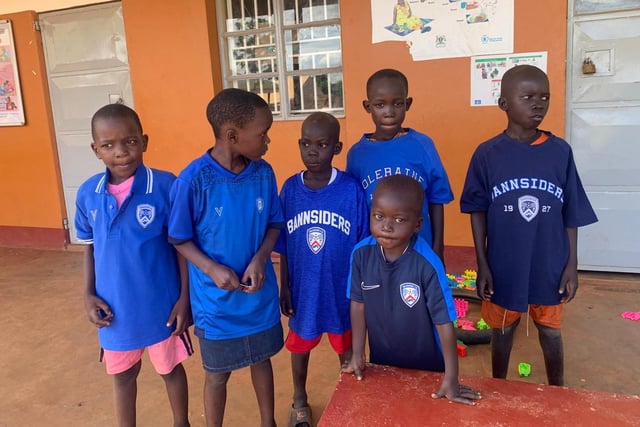 Some of the football-mad children of the Ugandan village of Dikka with their Coleraine FC shirts.