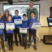 Ukrainian pupils from Kilmoyle Primary School collect their certificates of participation in the Minecraft Education SustainaBUILDity Competition. Alongside these pupils are Justin Edwards, Director of Learning Programmes at Microsoft; Alanna Cassidy, Microsoft Dream Space Learning Specialist at W5 LIFE; and Matthew Davidson, Dream Space Learning Specialist at W5 LIFE.