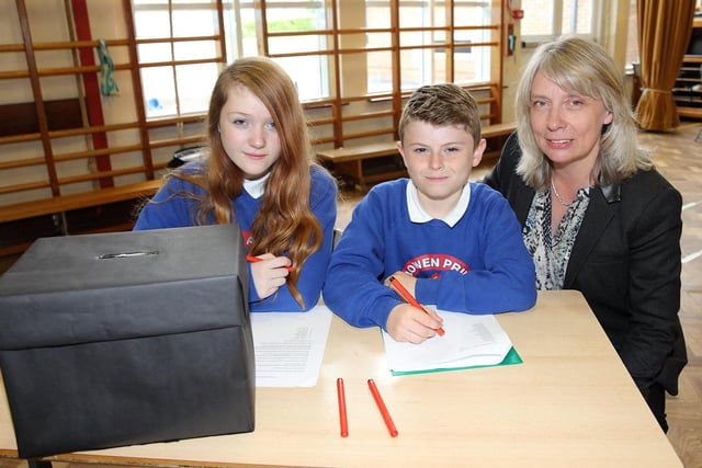 Killowen Primary School principal Fiona Douglas pictured with Natasha McCartney and Callum McComb who acted as presiding officers in the school's election to choose members of the pupils' council in 2015
