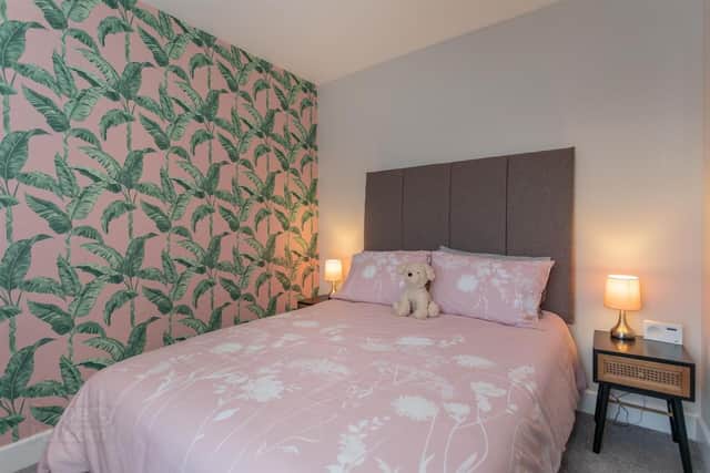 Both bedrooms feature mirrored slide robes.