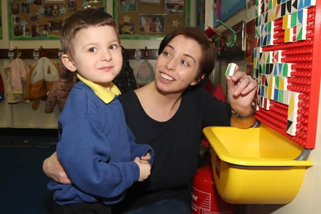 Teacher Mrs McMullan with a pupil at Ballymena Nursery School. Picture: Declan Roughan