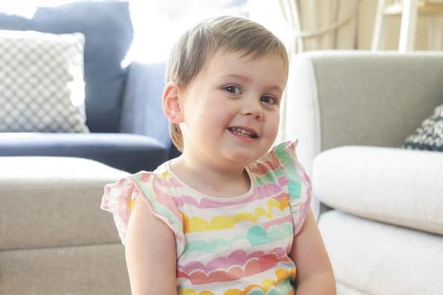 Ella is busy sorting her donations for Give Up Clothes for Good to help more children like her survive cancer. Picture: Brian Thompson