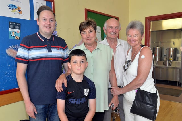 Enjoying the atmosphere at the Thomas Street Methodist Youth Fellowship coffee morning are from left, Daniel Friel, Bobby Magee (8), Fiona White and Wilfred and Faith Henderson. PT26-214.