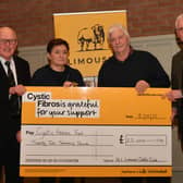 Jim Quail, Club President, Ian Davidson Snr and Brian McAuley, Club Chairman presented a cheque for £22,000 to Mary MacFarlane of the Cystic Fibrosis Trust at the Clubs AGM.