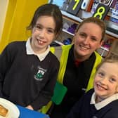 Members of the social committee at leading local manufacturer Mallaghan pictured enjoying some pancake day treats with students at Edendork Primary School.