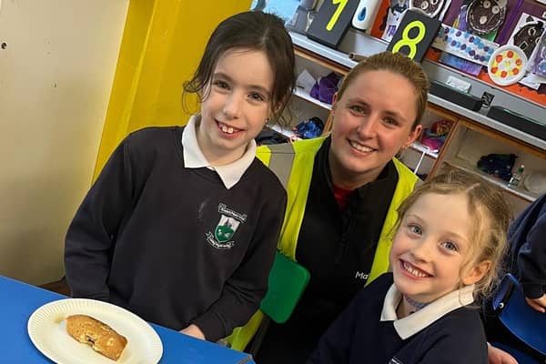 Members of the social committee at leading local manufacturer Mallaghan pictured enjoying some pancake day treats with students at Edendork Primary School.